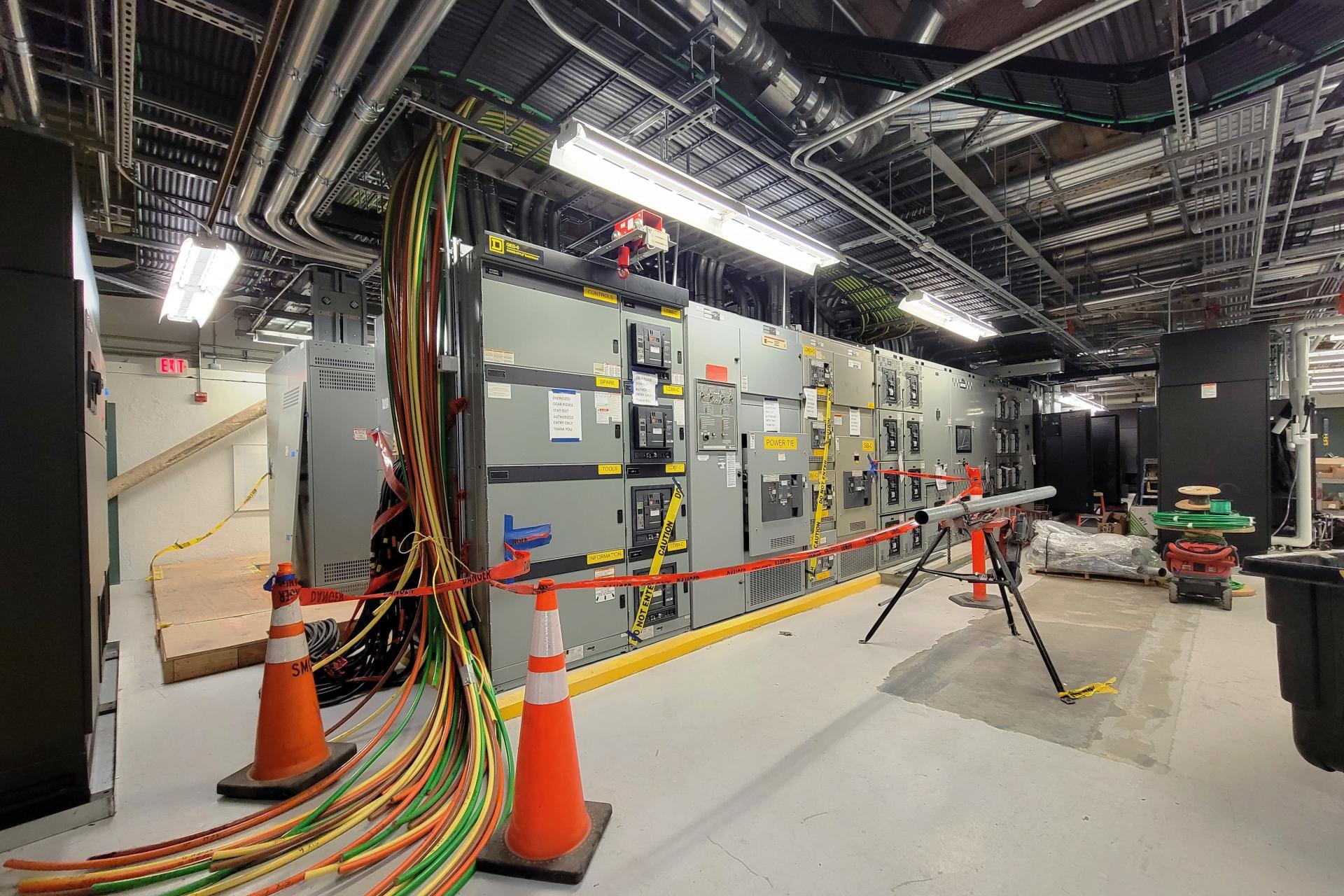 Switchgear, CRAHs, conduit and conductors in the process of installation 
