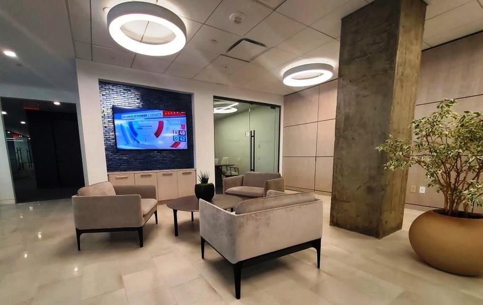 Soft seating within the reception area with led ring lights overhead