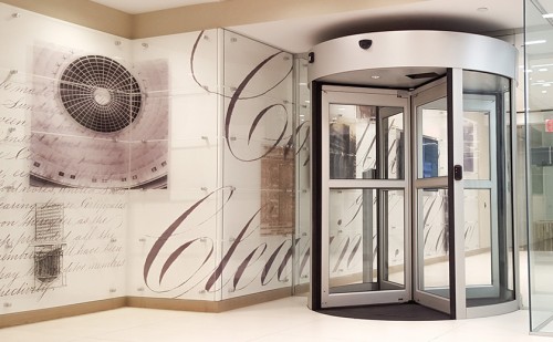 Super graphics created of historical documents from the corporate archive adorn the secure entry lobby  