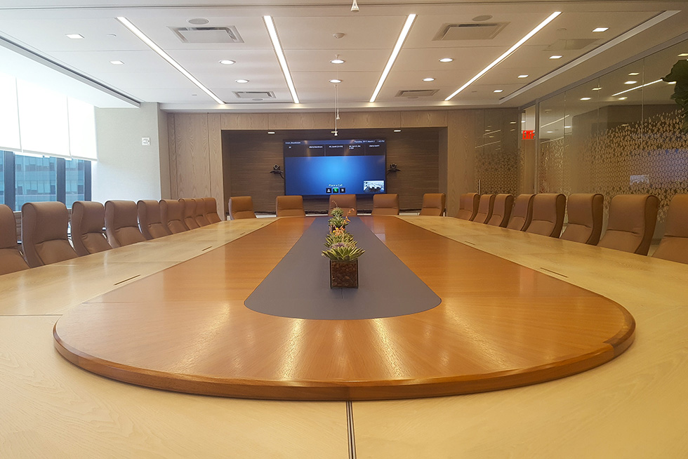 The large multi-function conference center currently configured for board meeting usage. The conference center can be subdivided into three smaller spaces to accommodate smaller group meetings and working session. Configurations include conference table, classroom, and lecture style seating. 