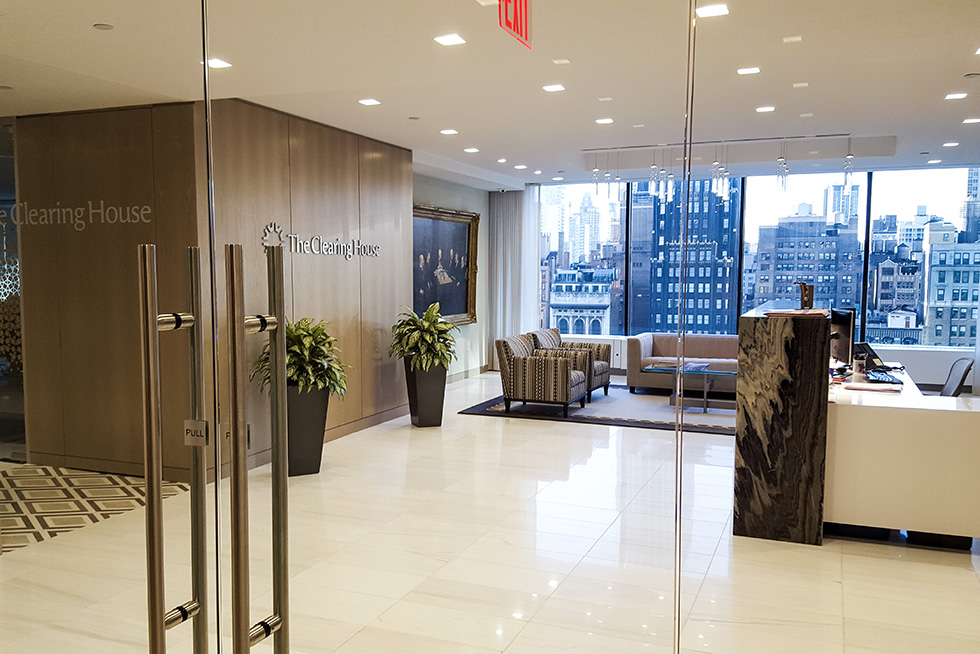 Entry into the new Executive Office reception area. The space has a panoramic view of Bryant Park. 